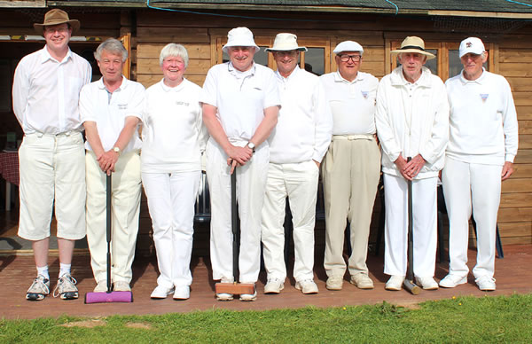 Colin Hadley(C) doing an angled roquet.